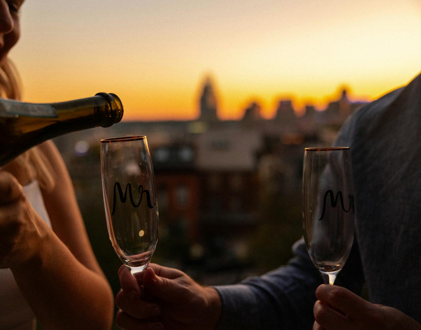 Two glasses of Champagne raised during a romantic evening in Paris