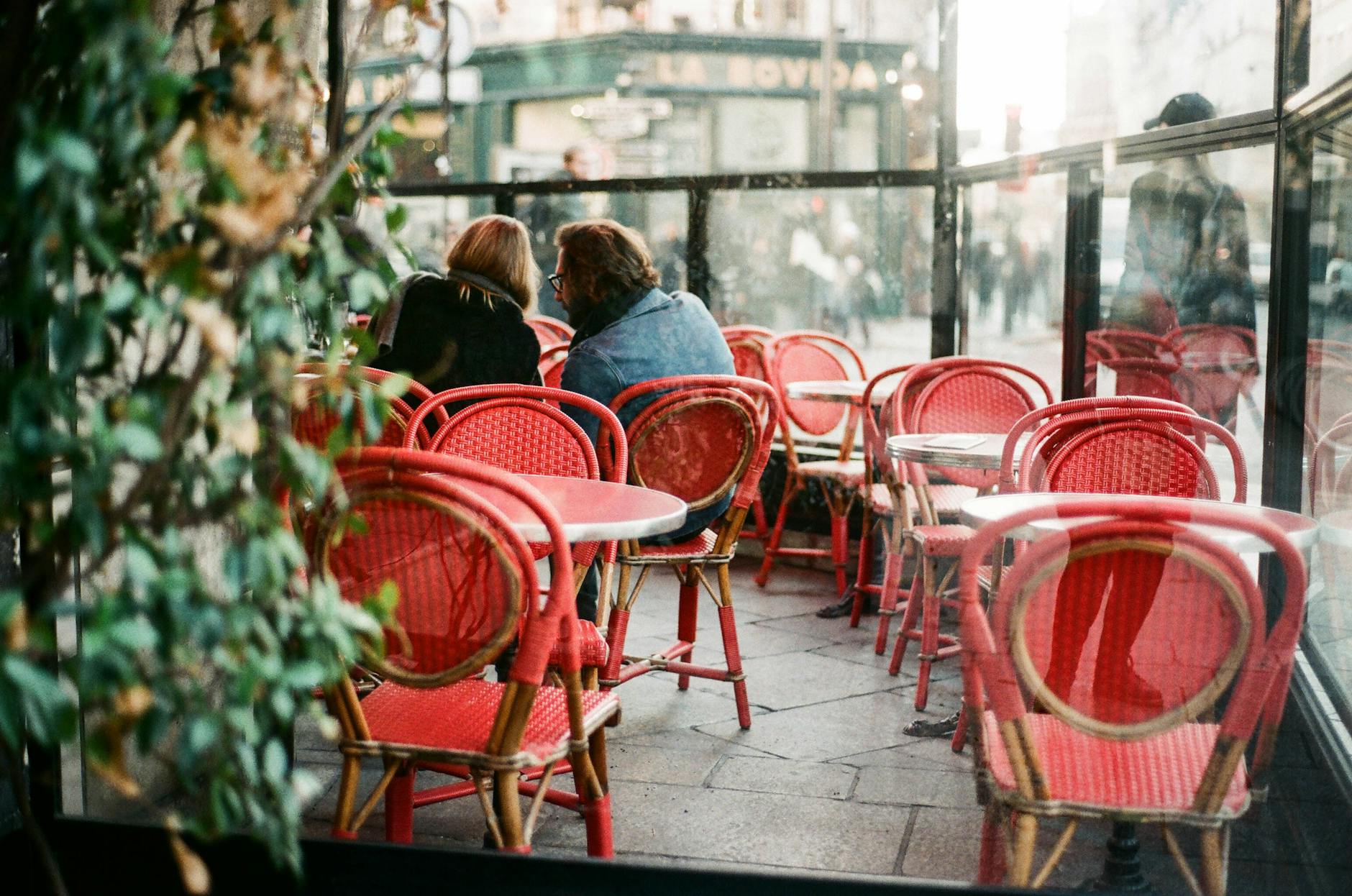 Couple sharing coffee on a Parisian café terrace