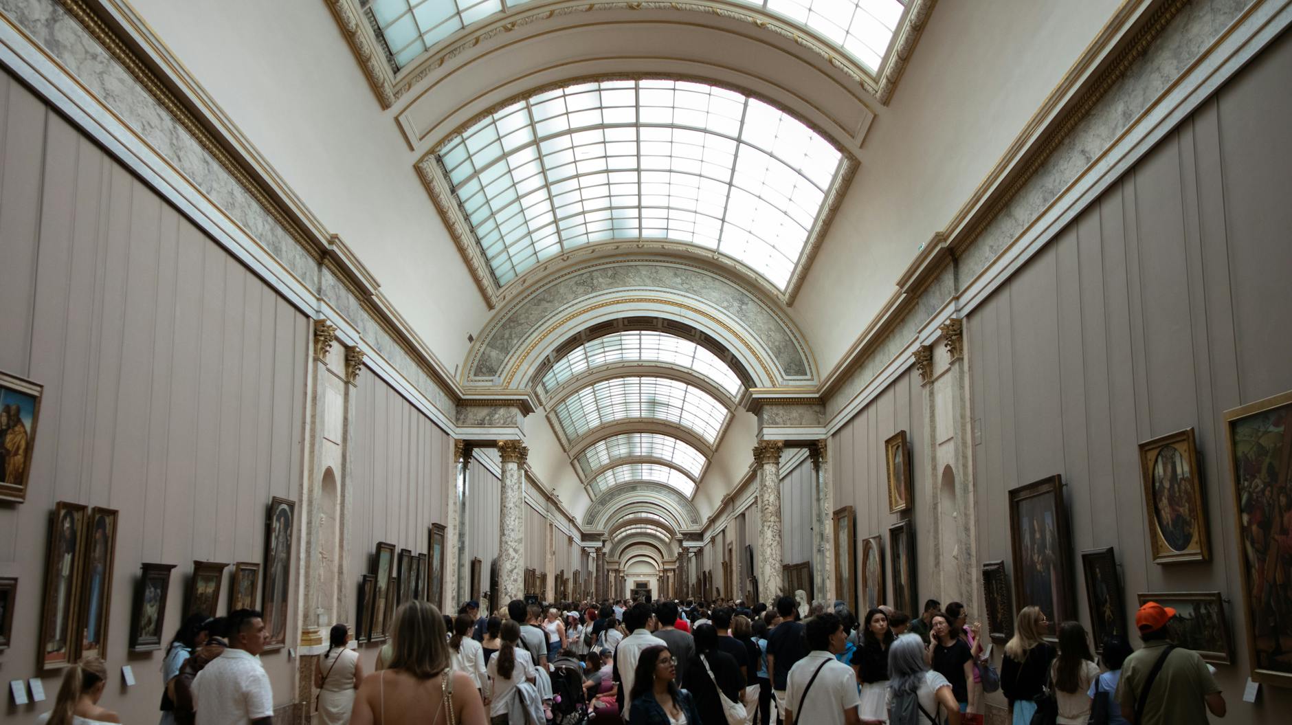 Family visiting the Louvre museum in Paris with kids