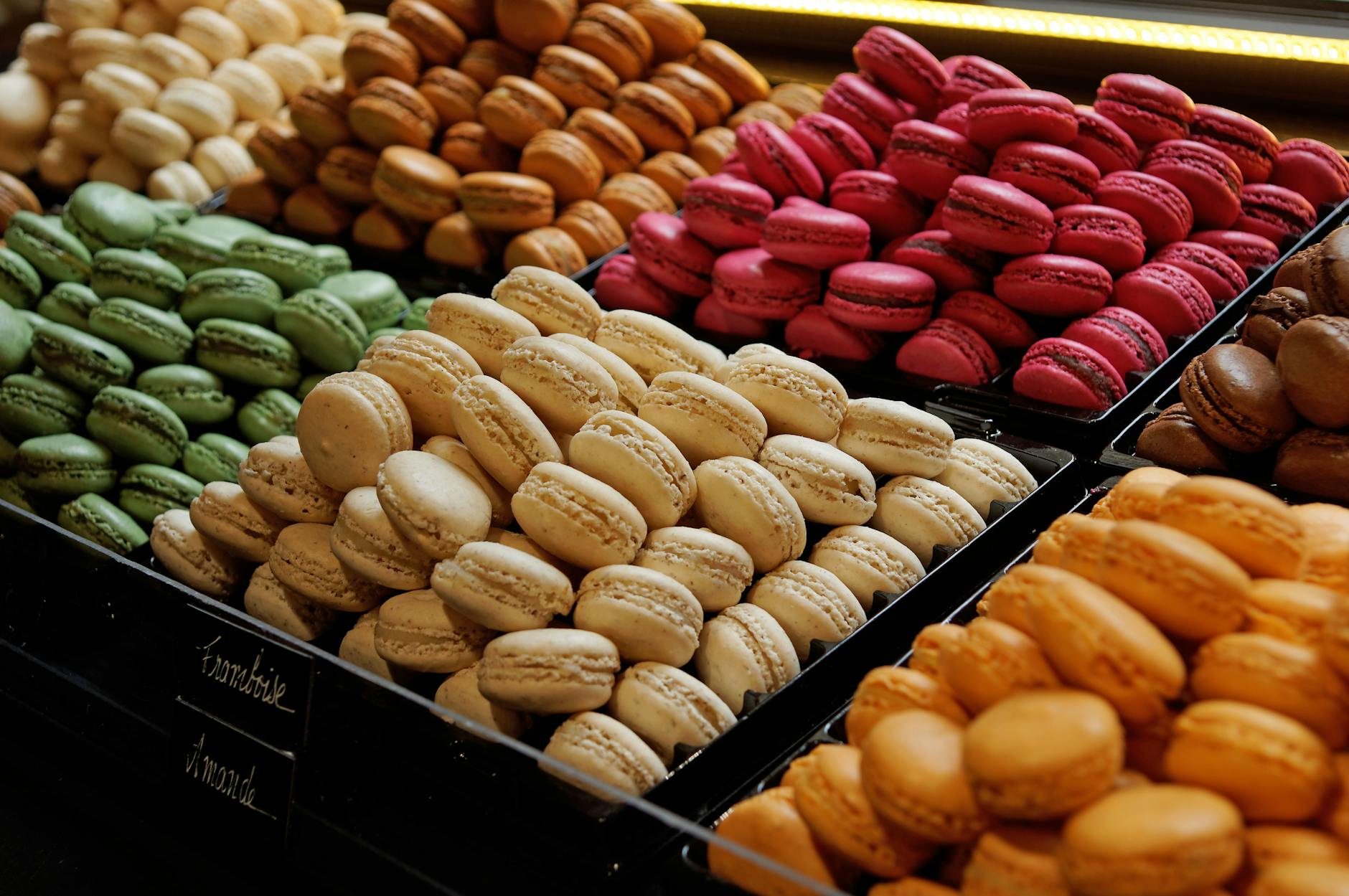 Colorful French macarons on display at a Paris patisserie