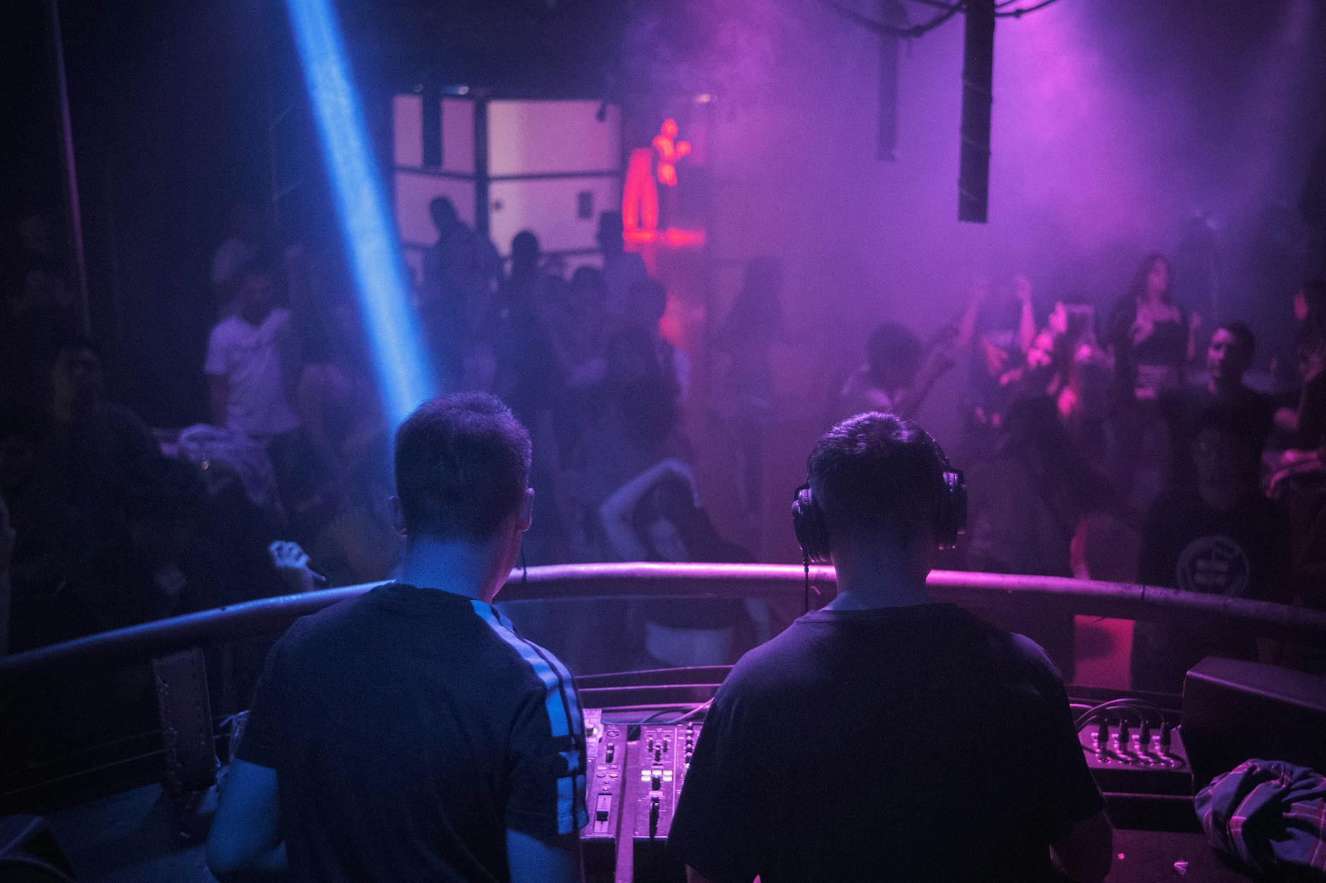 Energetic nightclub dance floor with electronic music in Paris