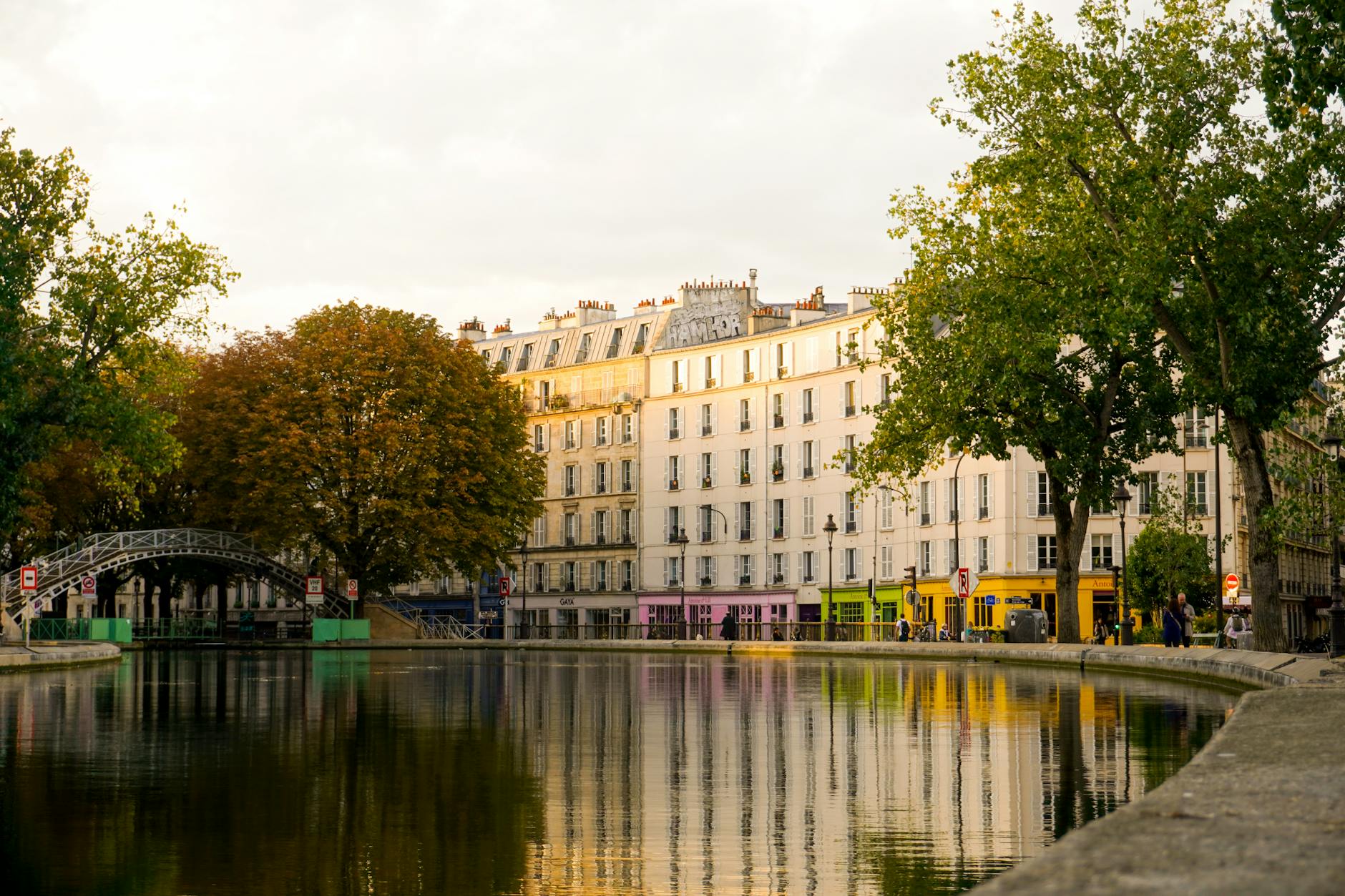 Peaceful Canal Saint-Martin lined with trees in Paris — a trendy neighborhood hotspot
