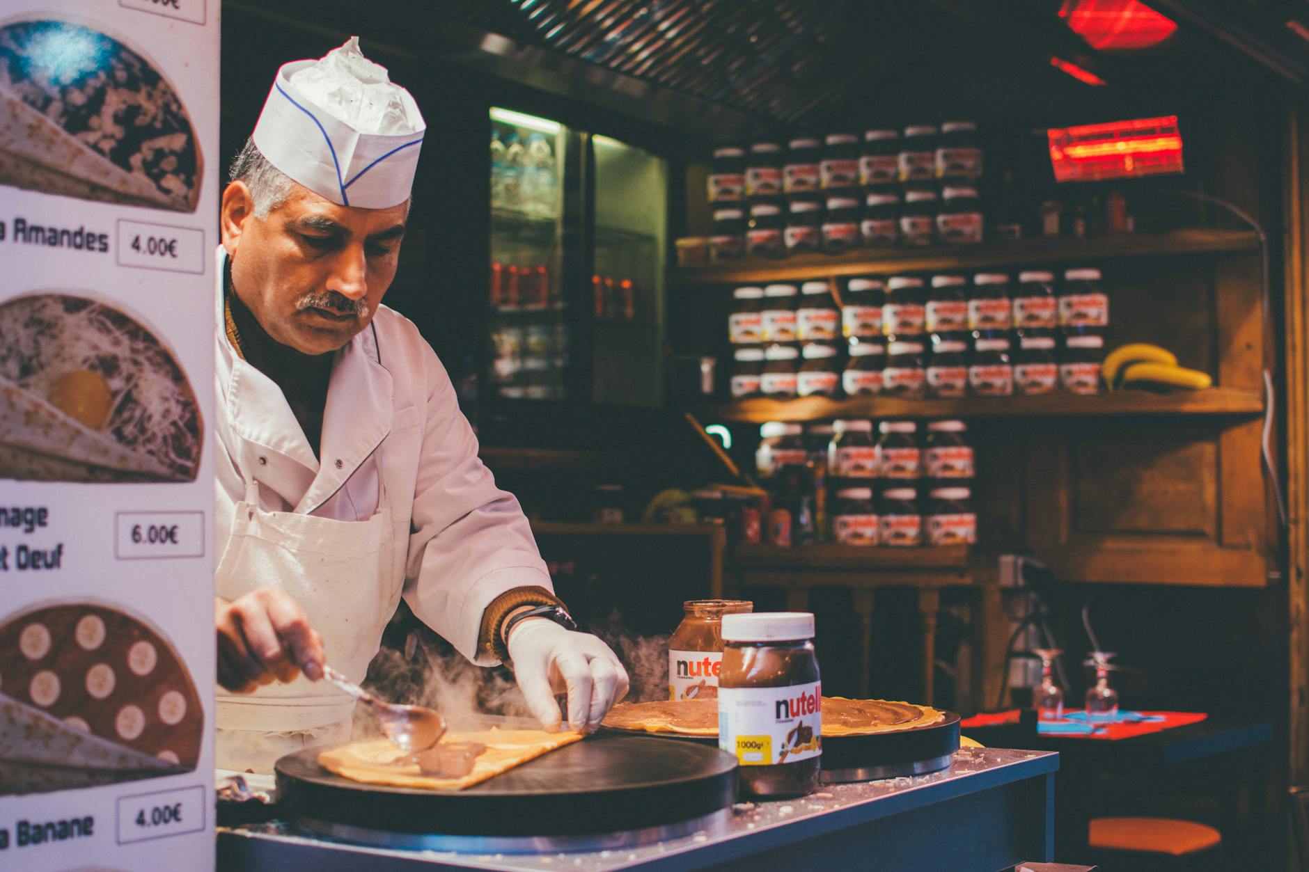Paris street crepes being prepared at a food stand in Montmartre
