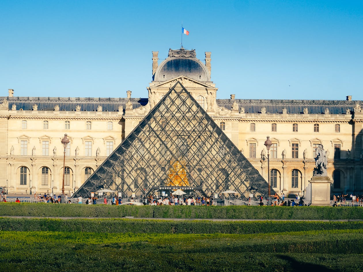 The Louvre Museum and iconic Glass Pyramid in Paris - world famous cultural landmark