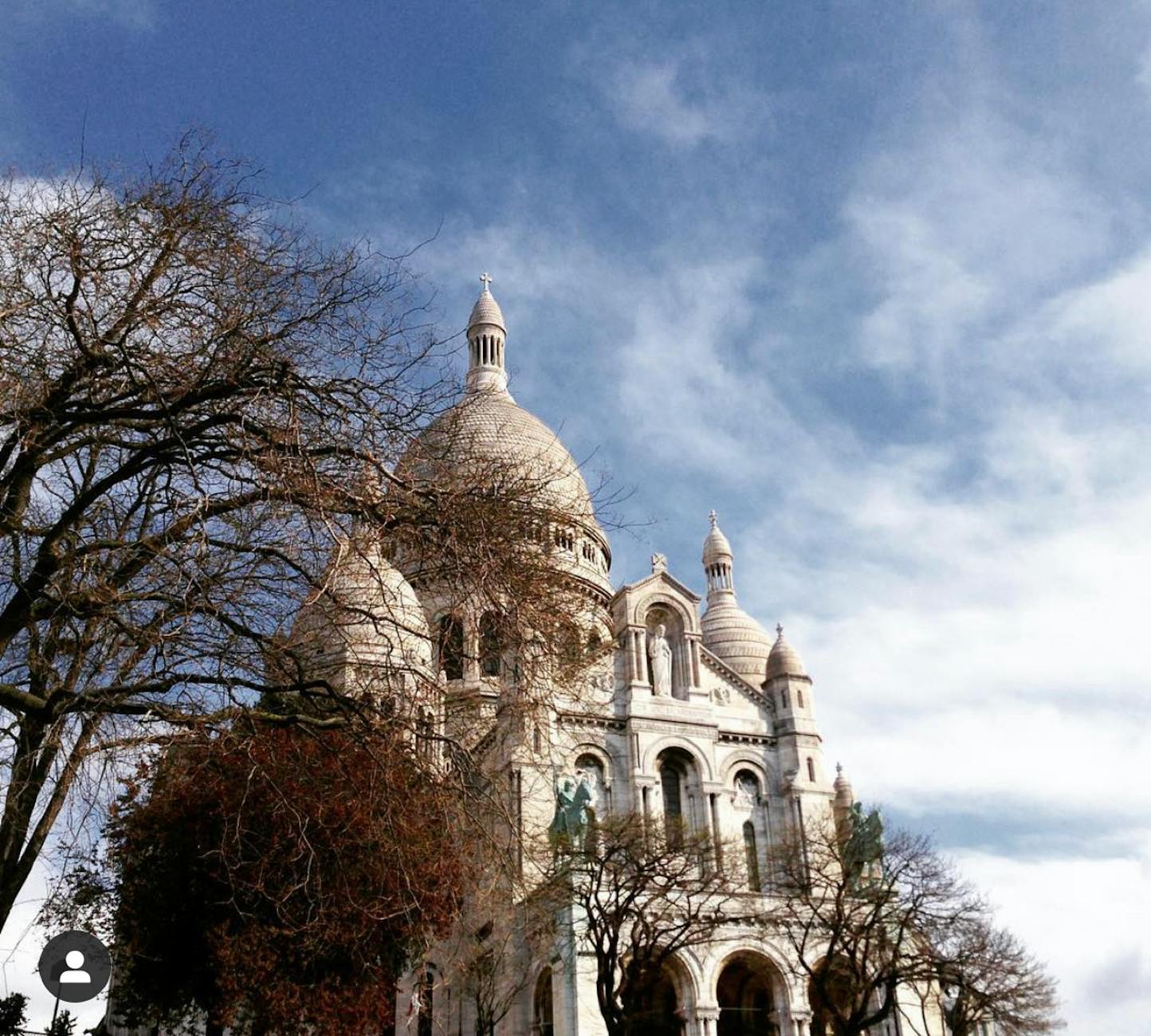 Sacré-Coeur Basilica crowning the Montmartre neighborhood hilltop in Paris