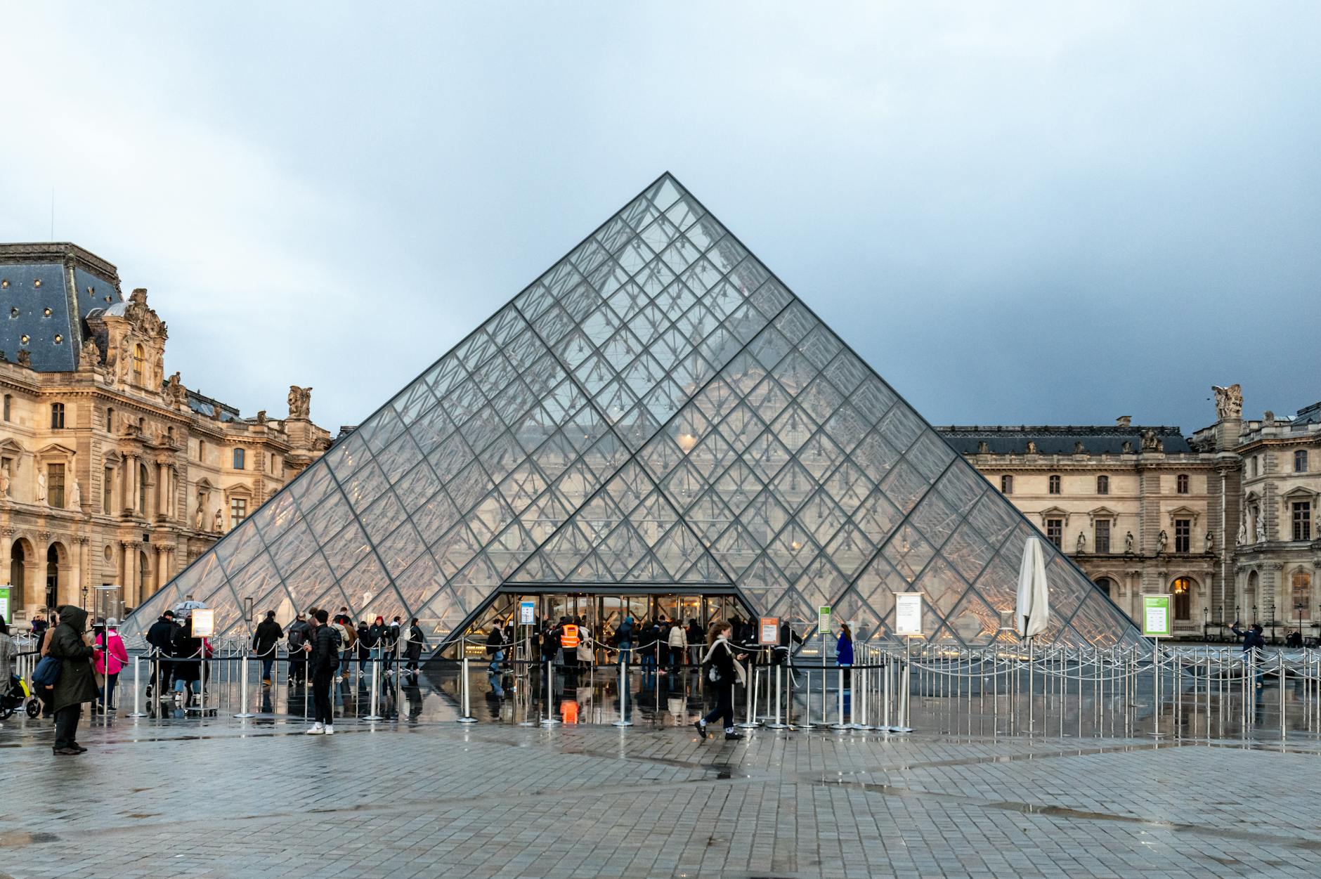 Visitors queuing at a popular Paris museum entrance