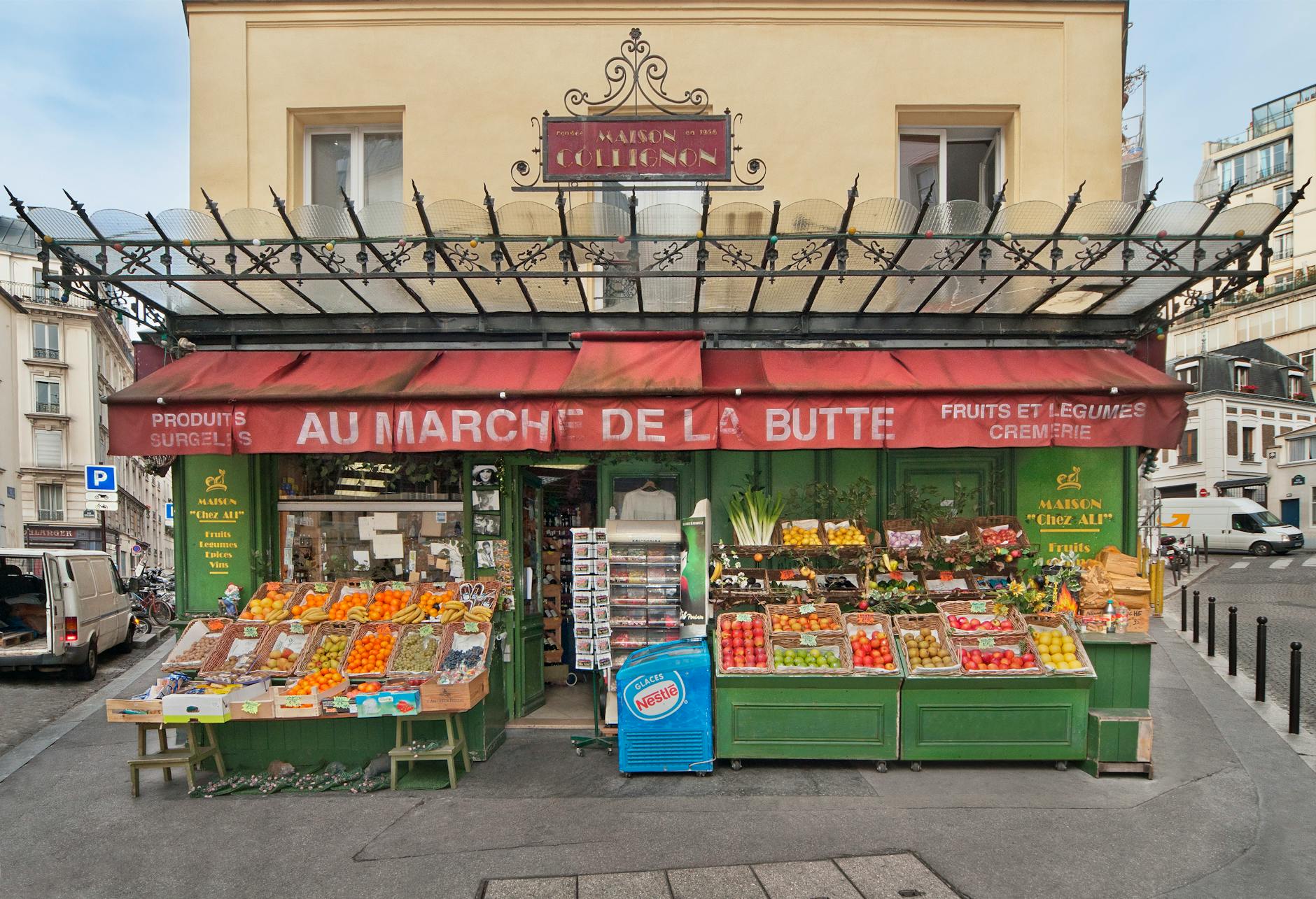 Colorful Paris street market with fresh produce — budget shopping like a local