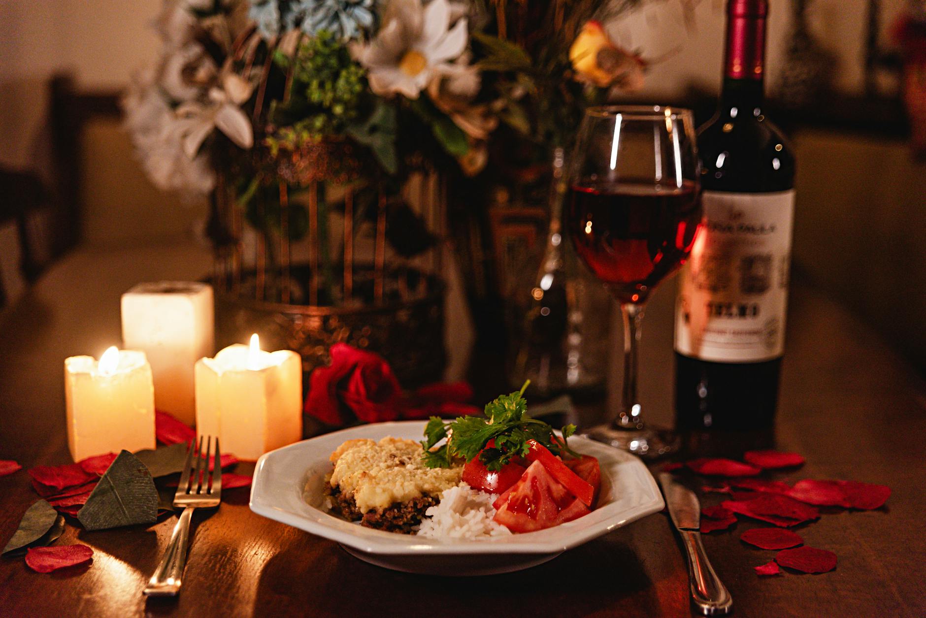 Couple at a candlelit dinner in a romantic Paris restaurant