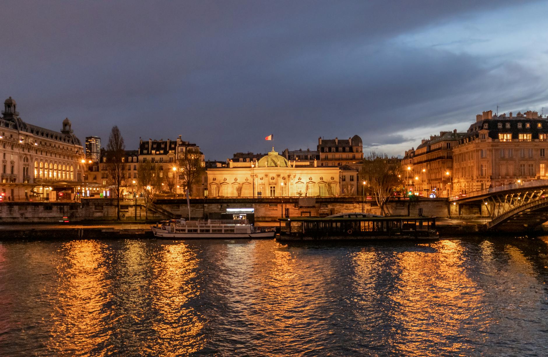 Seine river cruise in Paris with illuminated landmarks at night
