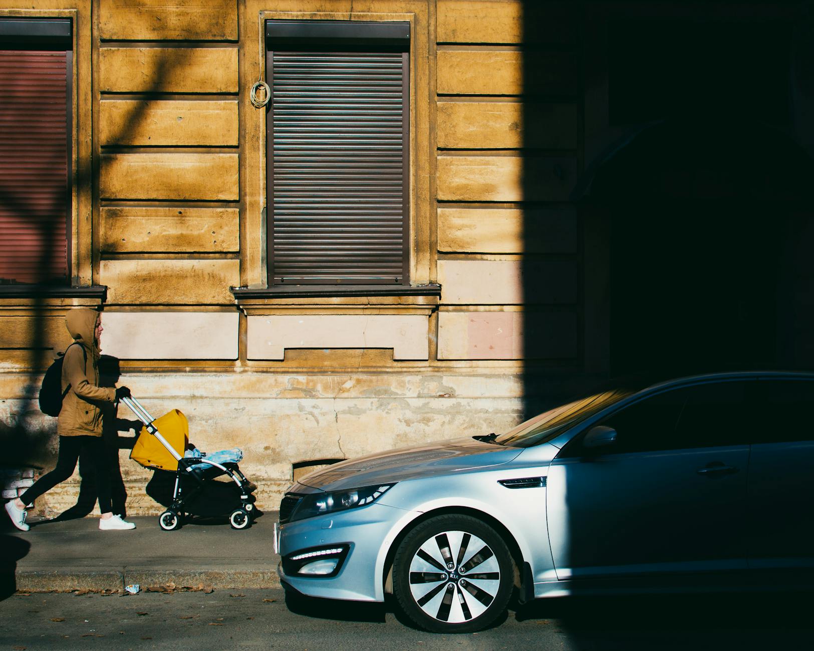 Parent with stroller navigating the streets of Paris