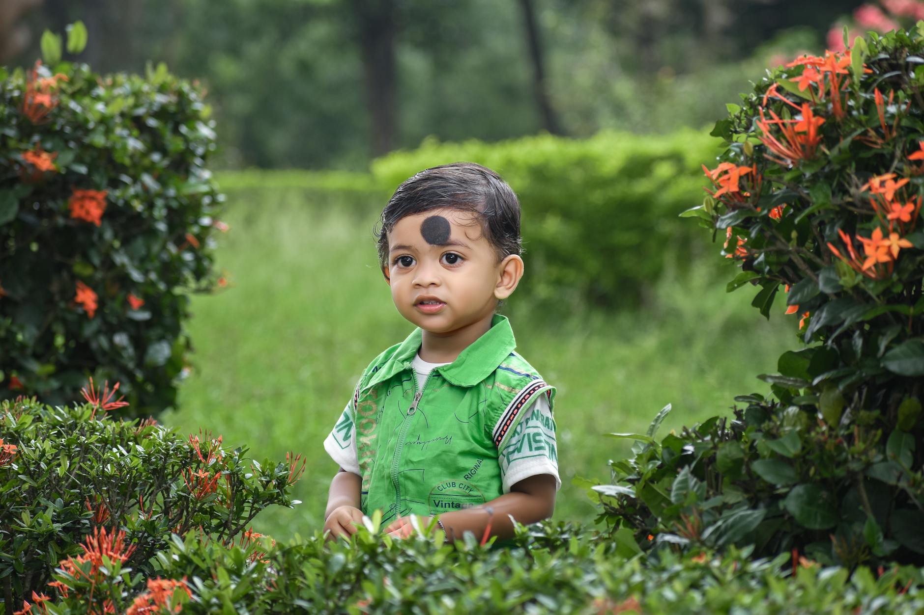 Toddler enjoying a beautiful Paris park and garden