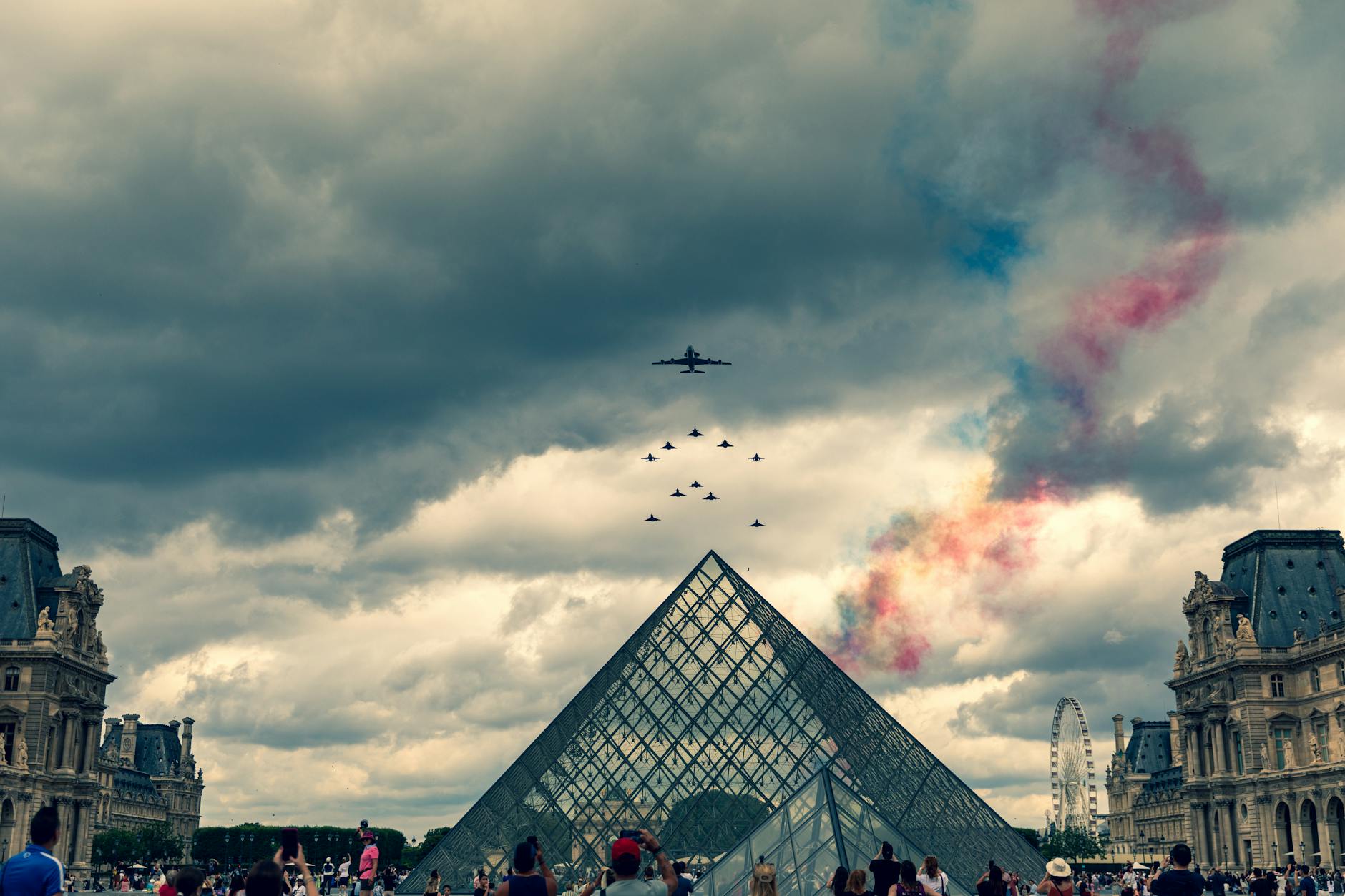 A Seine dinner cruise boat passing illuminated Paris landmarks
