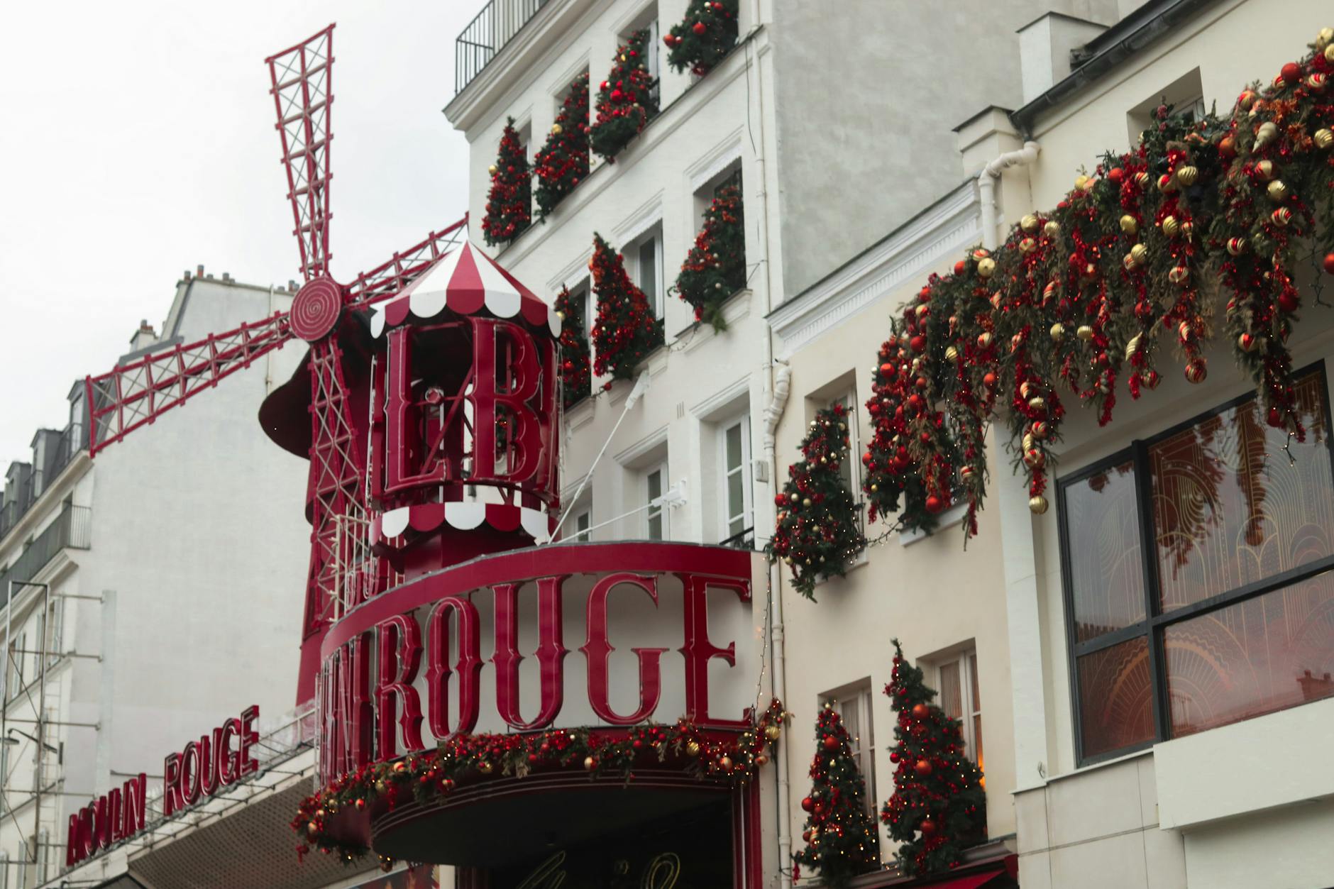 Wooden chalets and string lights at a Paris Christmas market