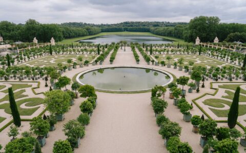 The formal parterres and circular basin of the Versailles gardens looking towards the Grand Canal
